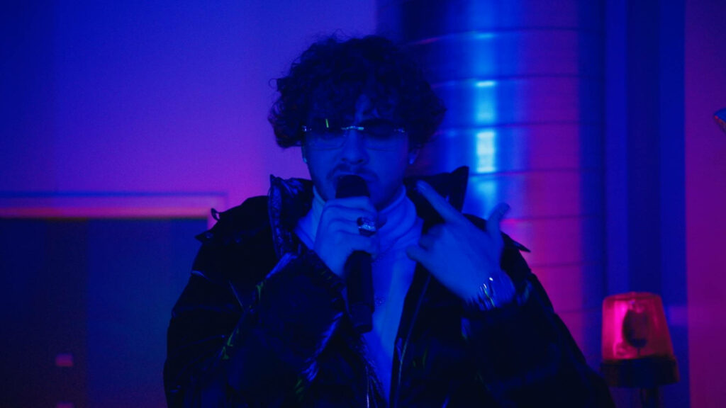 Jack Harlow Performing in Neon Lights - Charismatic Stage Wallpaper