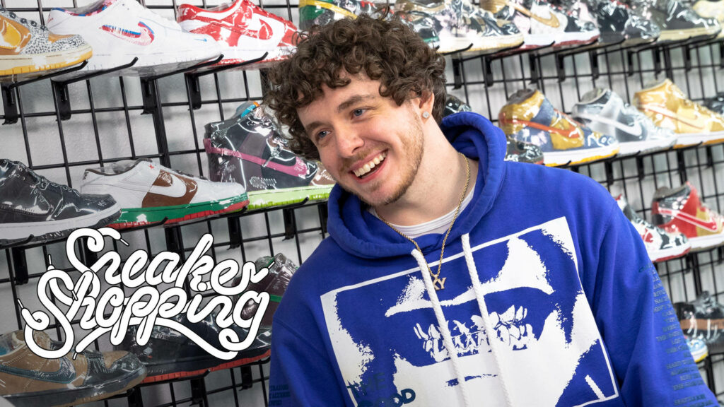 Jack Harlow Smiling in Sneaker Store: Stylish Colorful Wallpaper