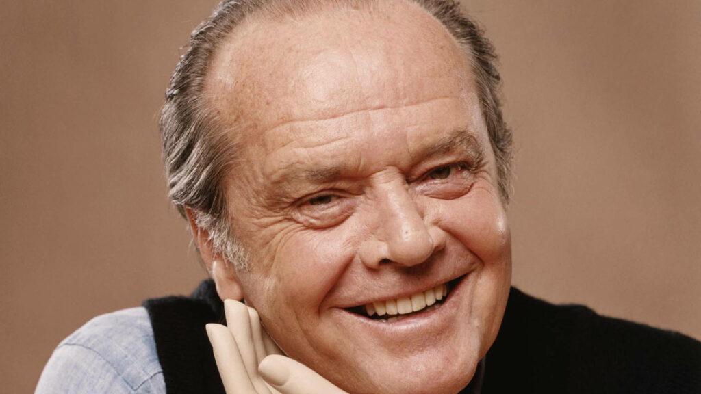 Close-Up Wallpaper of Smiling Jack Nicholson with Prosthetic Hand