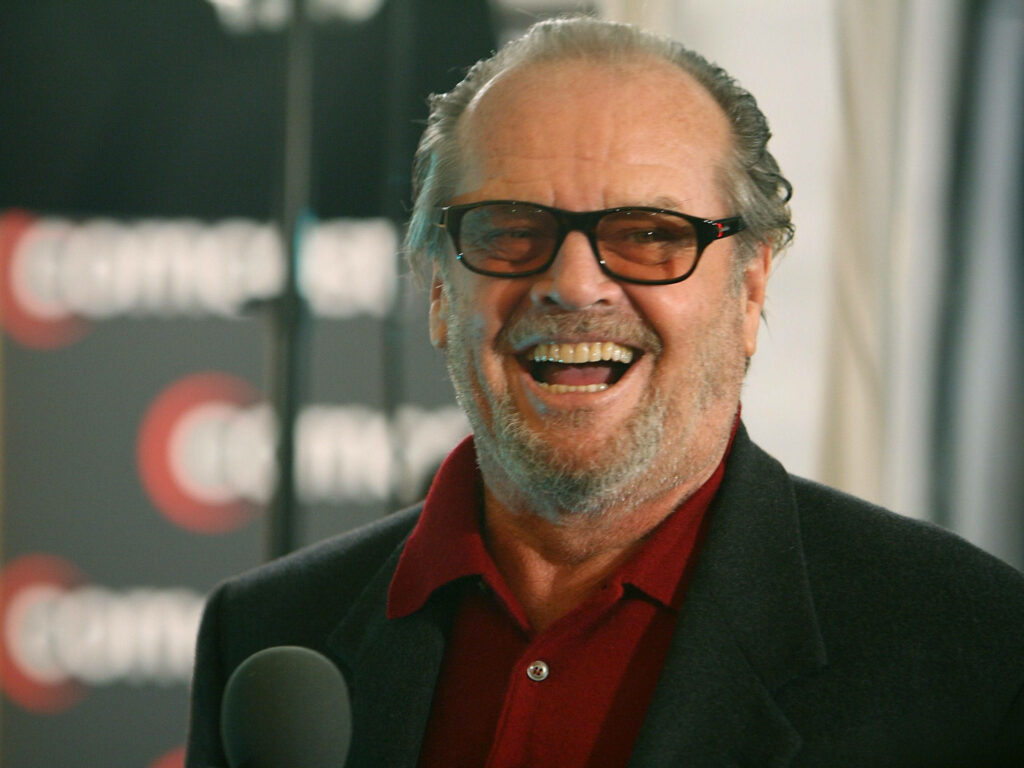Jack Nicholson Wallpaper: Iconic Smile in Red Shirt & Sunglasses