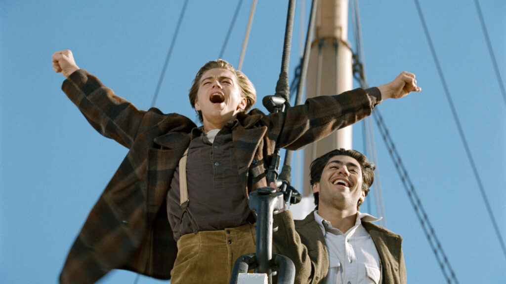 Jack and Fabrizio on Titanic bow arms outstretched iconic freedom scene classic movie wallpaper