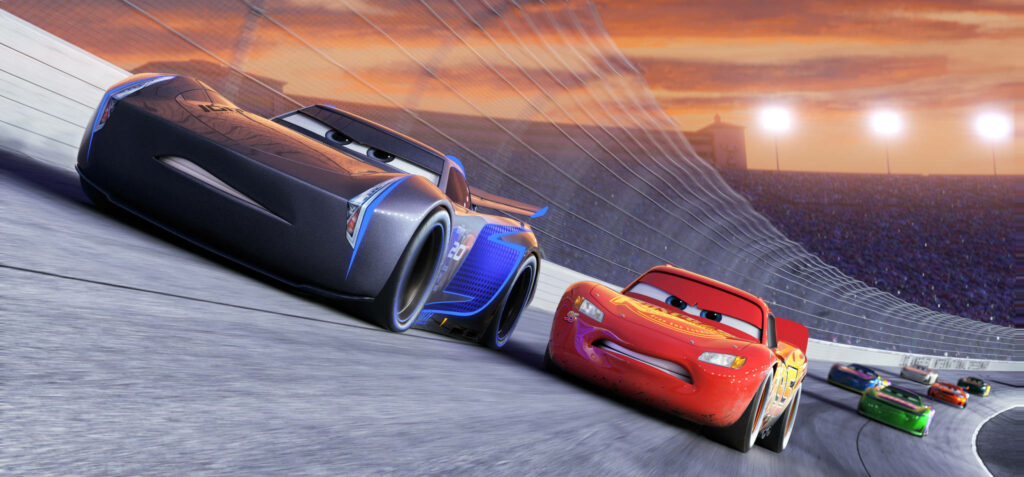Jackson Storm and Lightning McQueen racing side by side on vibrant sunset track Cars 3 wallpaper