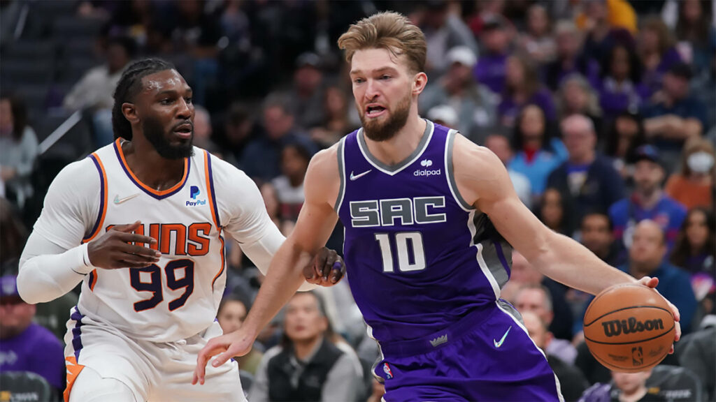 Jae Crowder Phoenix Suns defends Domantas Sabonis Sacramento Kings intense basketball action wallpaper