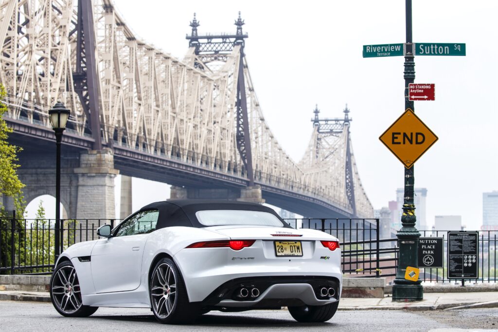 Stunning Jaguar F-Type R AWD Near Queensboro Bridge: Urban Vibes Wallpaper