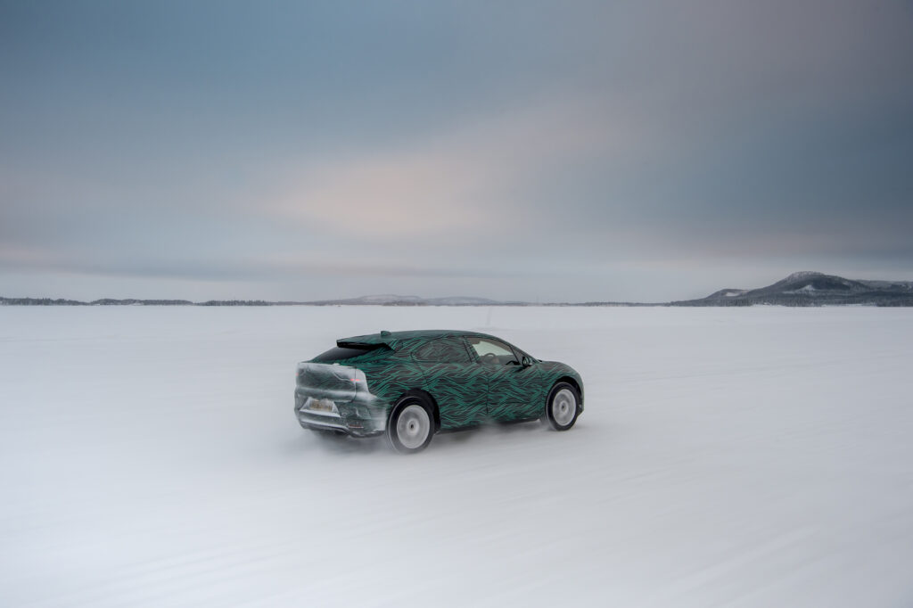 Jaguar I-Pace in Motion: Winter Landscape Adventure Wallpaper