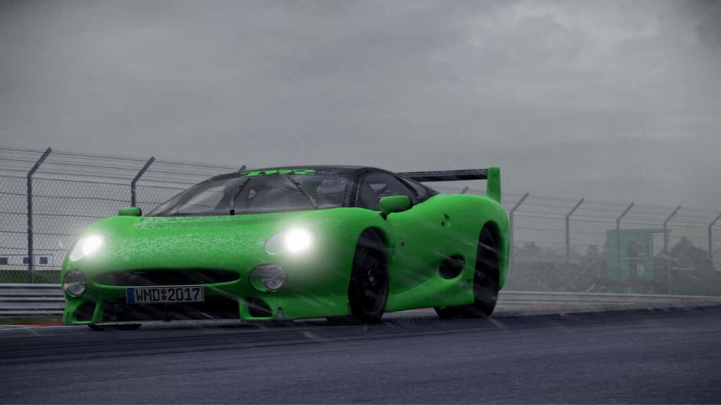 Jaguar XJ220S TWR Wallpaper: Sleek Design in Rainy Action