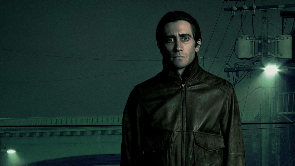Jake Gyllenhaal in dark leather jacket intense moody urban Nightcrawler wallpaper background