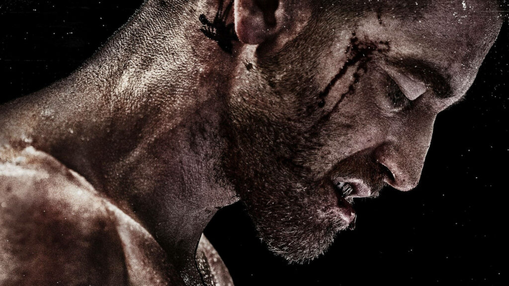 Jake Gyllenhaal as Bleeding Billy Hope intense fighter with bruised face sweat and blood wallpaper