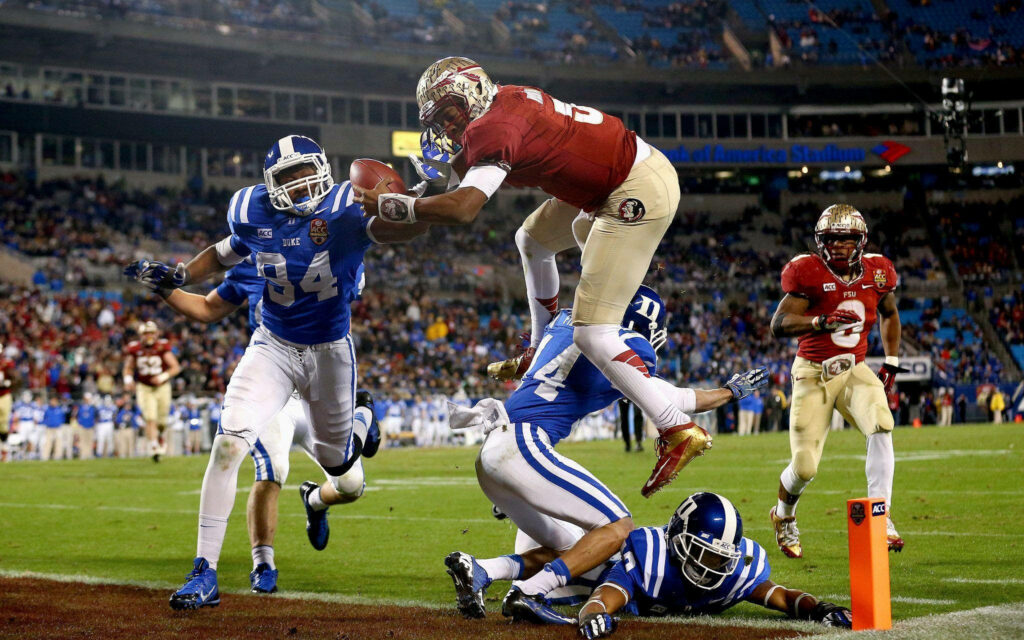 Dynamic Jameis Winston Wallpaper: Intense Game Moment on Field