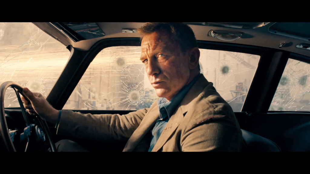 James Bond in Classic Car: Intense Scene from No Time To Die Wallpaper