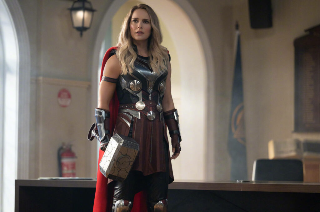 Jane Foster in Thor armor holding Mjolnir with confused look from Thor Love and Thunder wallpaper