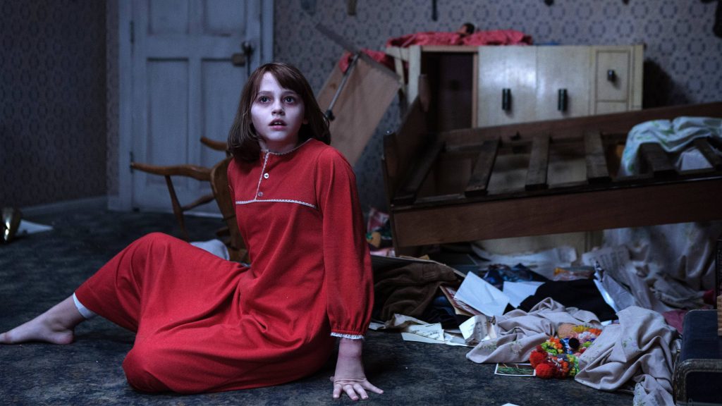 Janet Hodgson in red nightgown in dim chaotic bedroom scene from The Conjuring 2 wallpaper