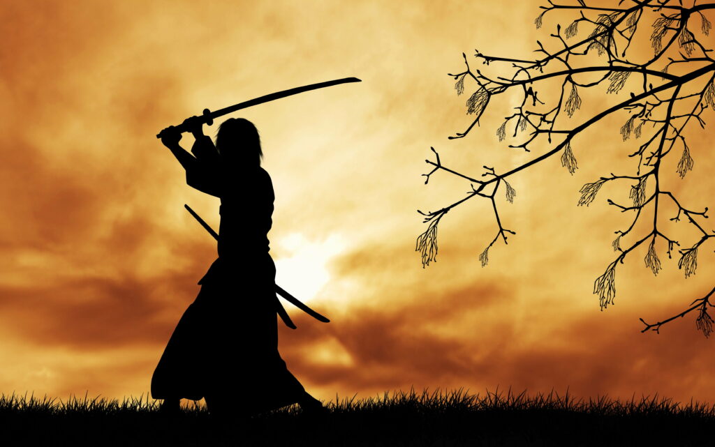 Japanese Warrior in Silhouette: a Digital Wallpaper of a Samurai in Traditional Clothes, wielding a Katana on a Stunning Background