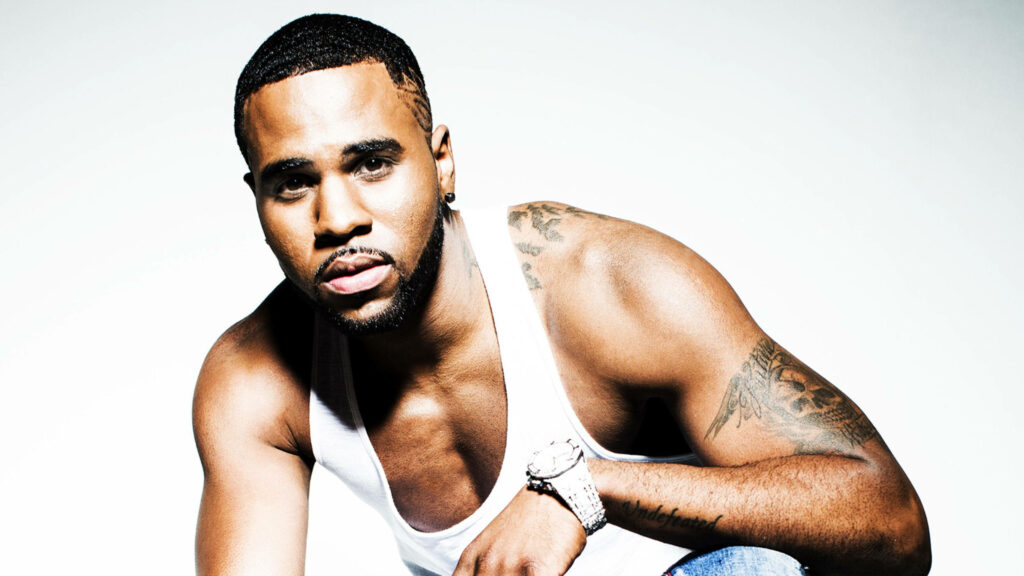 Jason Derulo in white tank top showing tattoos with confident expression athletic wallpaper