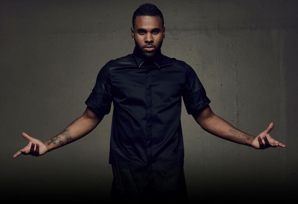 Jason Derulo bold pose with arms extended dark minimalist background stylish wallpaper