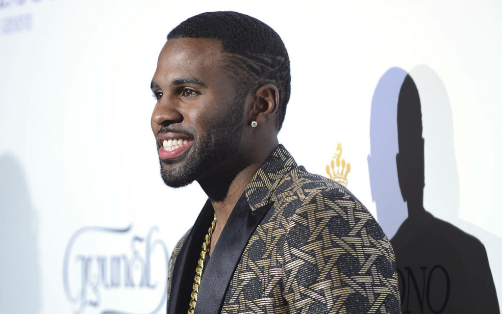 Jason Derulo at 67th Cannes Festival wearing stylish patterned jacket white backdrop wallpaper