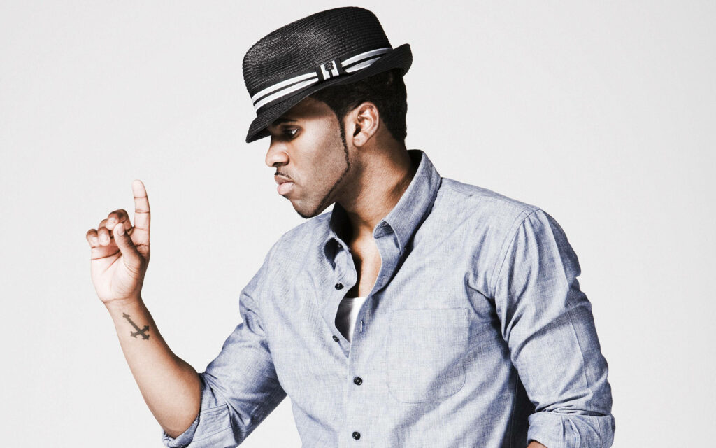 Jason Derulo confident pose in light denim shirt and fedora hat white background wallpaper