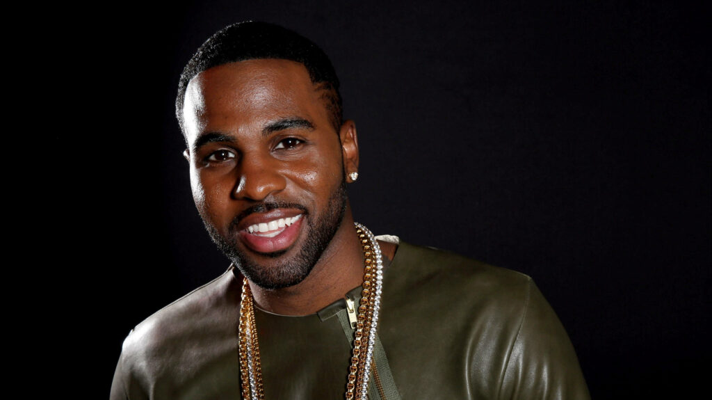 Jason Derulo smiling confidently dark background charismatic pop star wallpaper image
