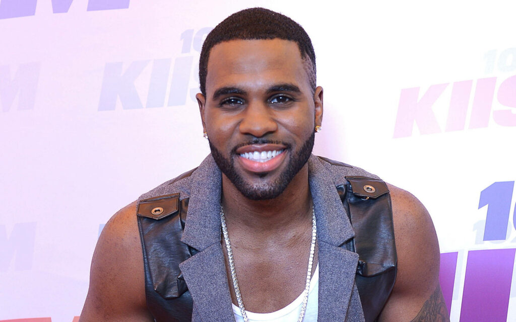 Jason Derulo smiling at 2013 Wango Tango event colorful background wallpaper image