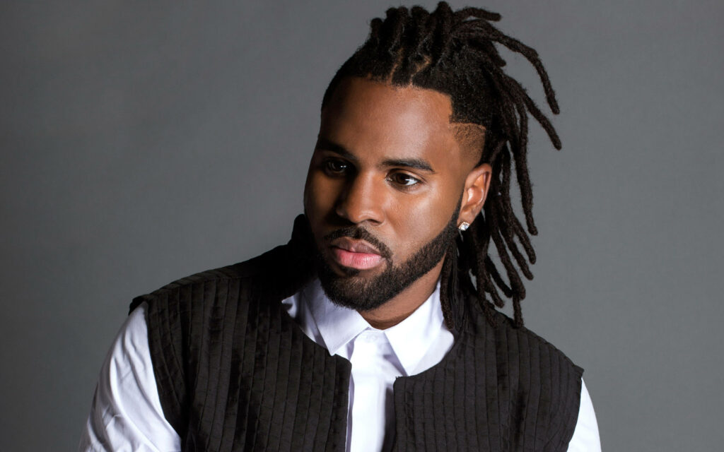 Jason Derulo in black textured jacket white shirt gray background stylish dreadlocks wallpaper