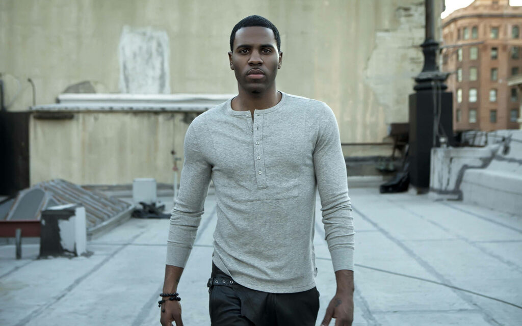 Jason Derulo walking confidently on rooftop urban background stylish relaxed fashion wallpaper