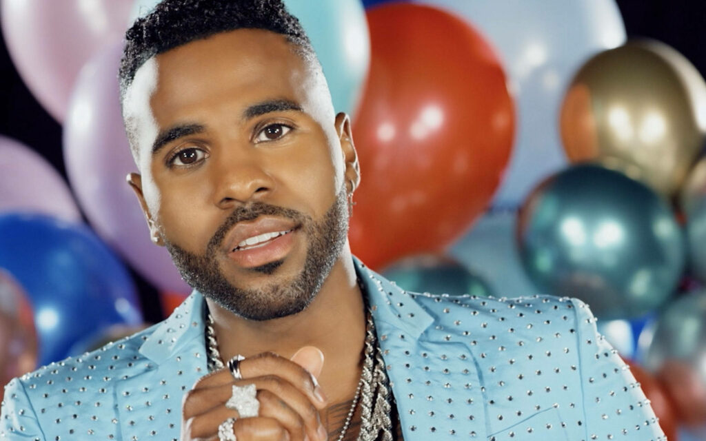 Jason Derulo in studded blue jacket with colorful balloons vibrant Goodbye music video scene Wallpaper