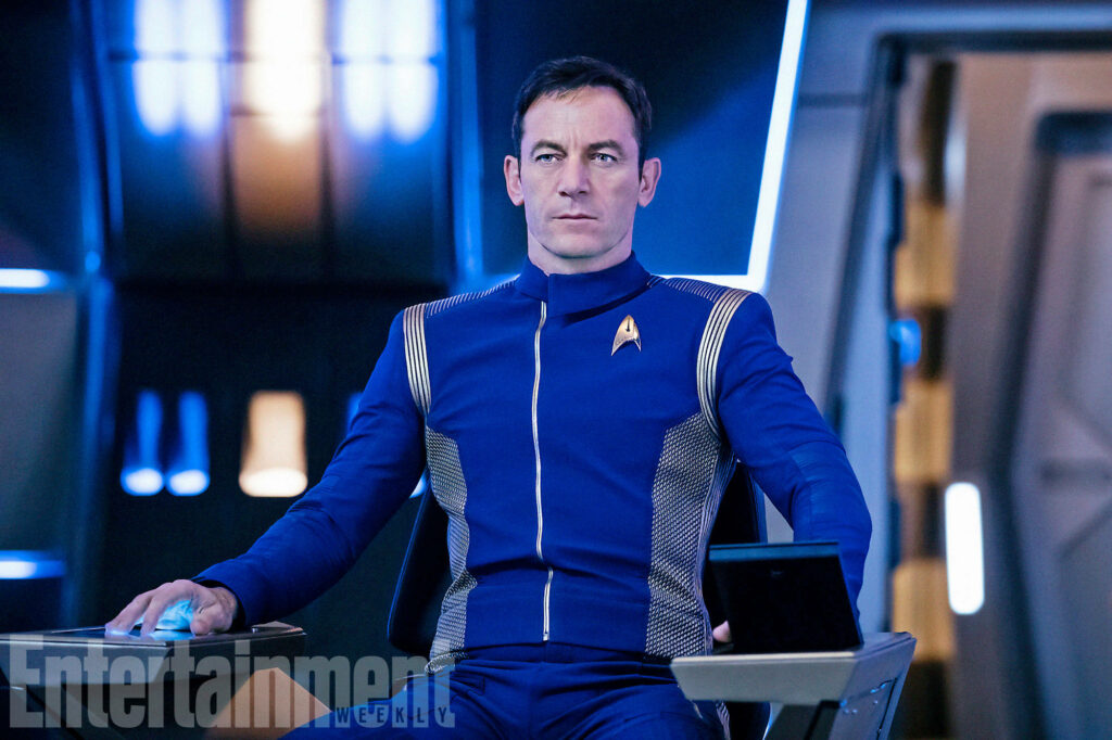 Jason Isaacs Embracing the Futuristic Charm: A Captivating Portrait of the Acclaimed Actor on a Star Trek Chair Wallpaper
