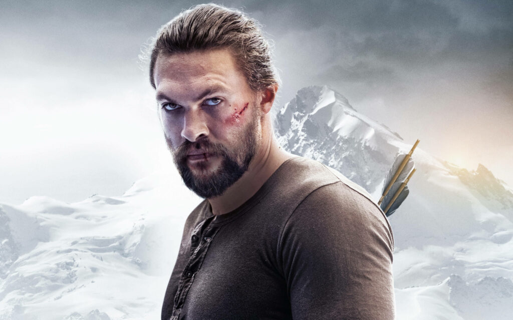 Jason Momoa as Braven standing determined in snowy mountain background wallpaper scene