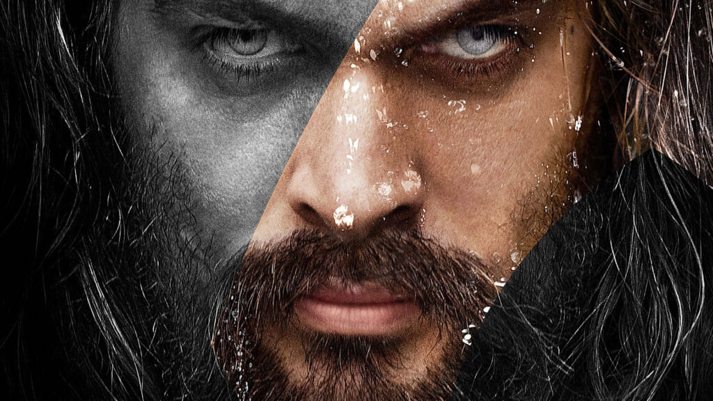 Close-up of Jason Momoa intense face with piercing eyes rugged features split-tone wallpaper background