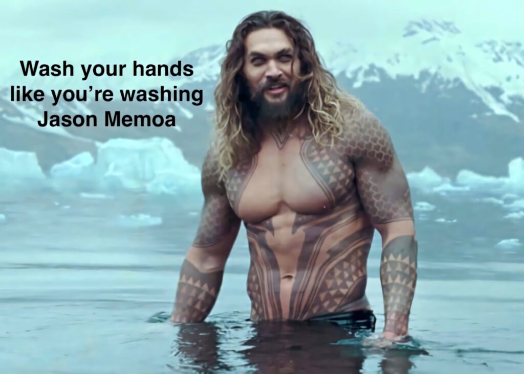 Jason Momoa meme wallpaper promoting COVID-19 handwashing with humor and hygiene advice