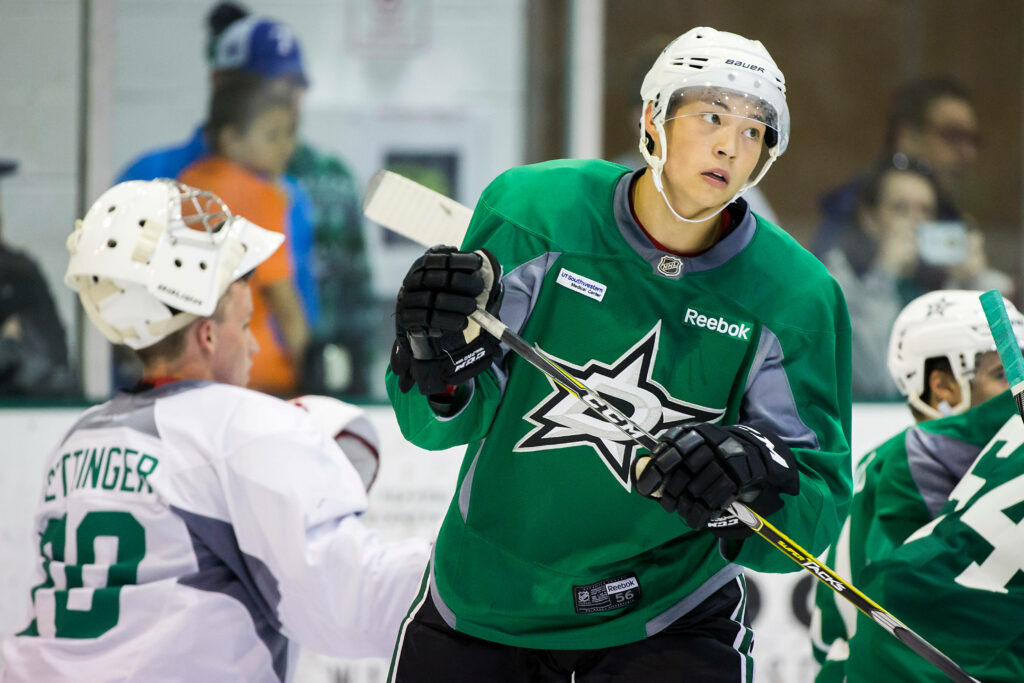 Jason Robertson in green Dallas Stars jersey shows focus during dynamic development camp training Wallpaper