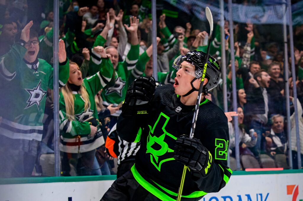 Jason Robertson Dallas Stars celebrates victory over Winnipeg Jets in black neon green uniform Wallpaper