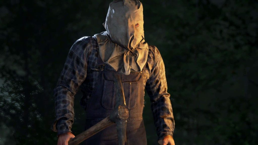 Jason Voorhees in sack mask and overalls holding pickaxe in dark woods horror wallpaper