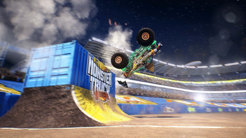 Jawbreaker monster truck mid-air stunt off ramp in packed stadium night lights wallpaper