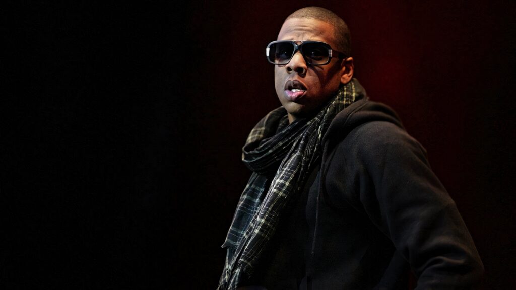 Jay-Z American rapper wearing dark sunglasses hoodie plaid scarf moody hip-hop style wallpaper