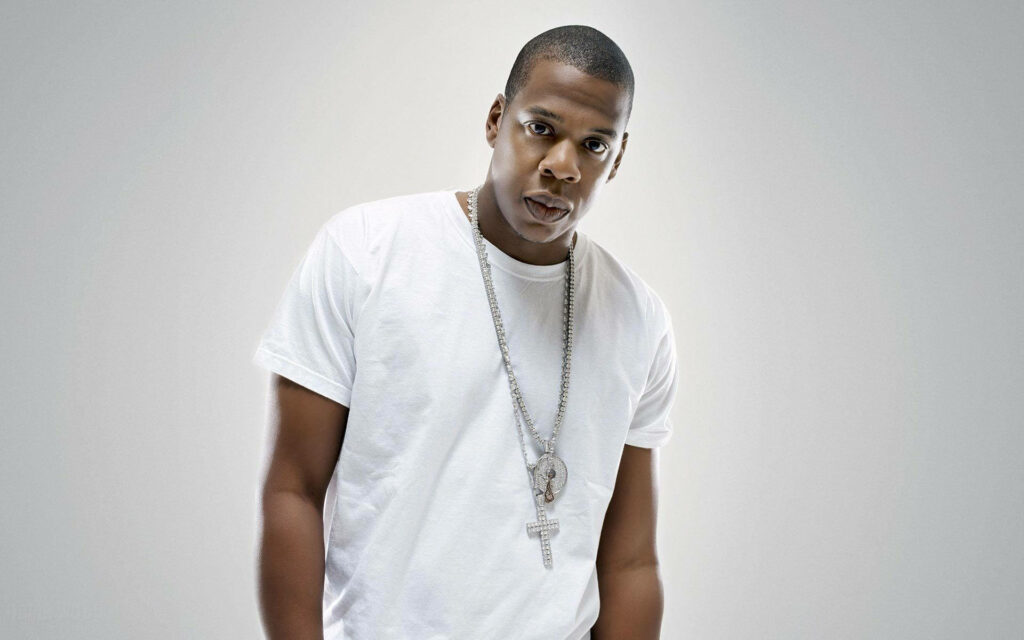 Jay-Z confident minimalist photoshoot wearing white t-shirt and chain on clean light background wallpaper