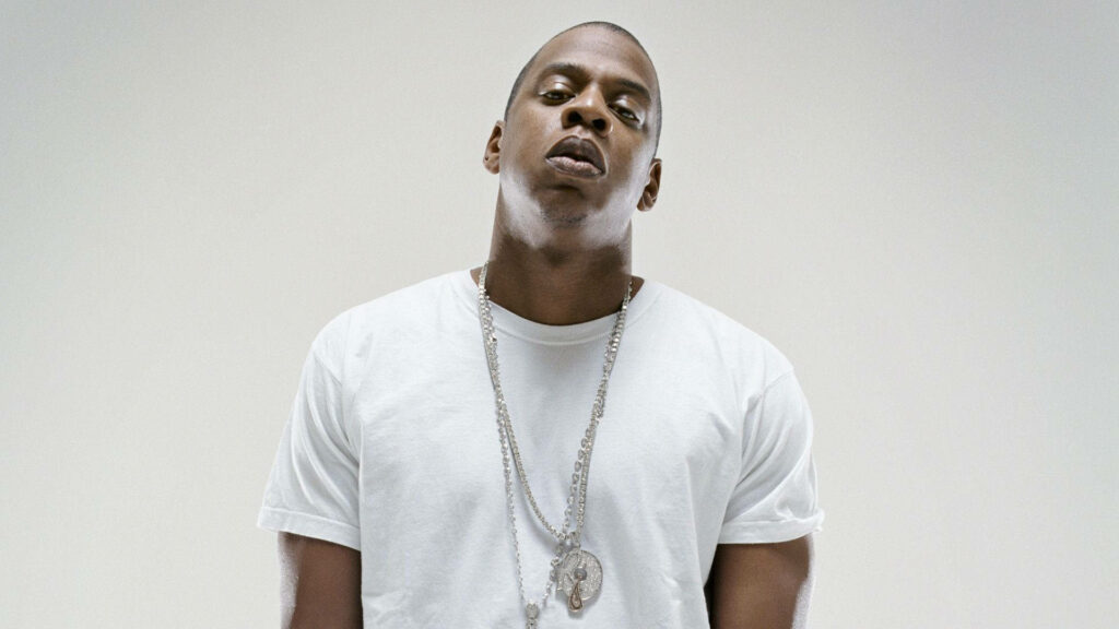 Jay Z portrait wallpaper rapper in white shirt with layered chains on light background iconic look