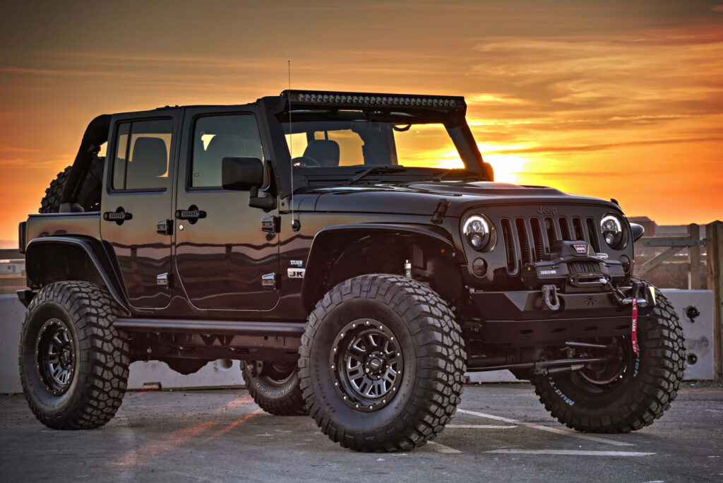 Jeep Wrangler Wallpaper: Rugged Adventure Against a Stunning Sunset