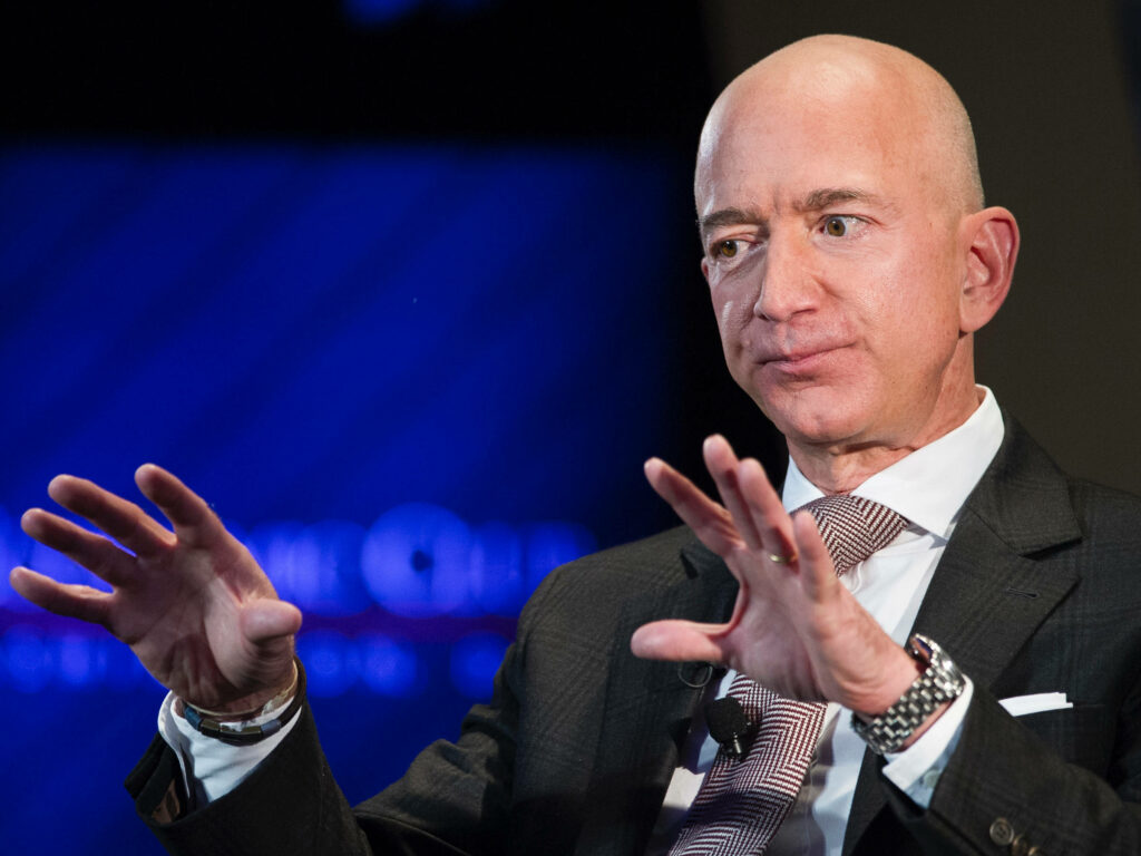 Jeff Bezos in Formal Attire: Professional Wallpaper Background
