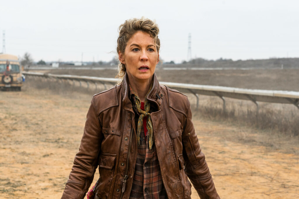 Jenna Elfman as Naomi: Striking Outdoor Wallpaper of Resilience