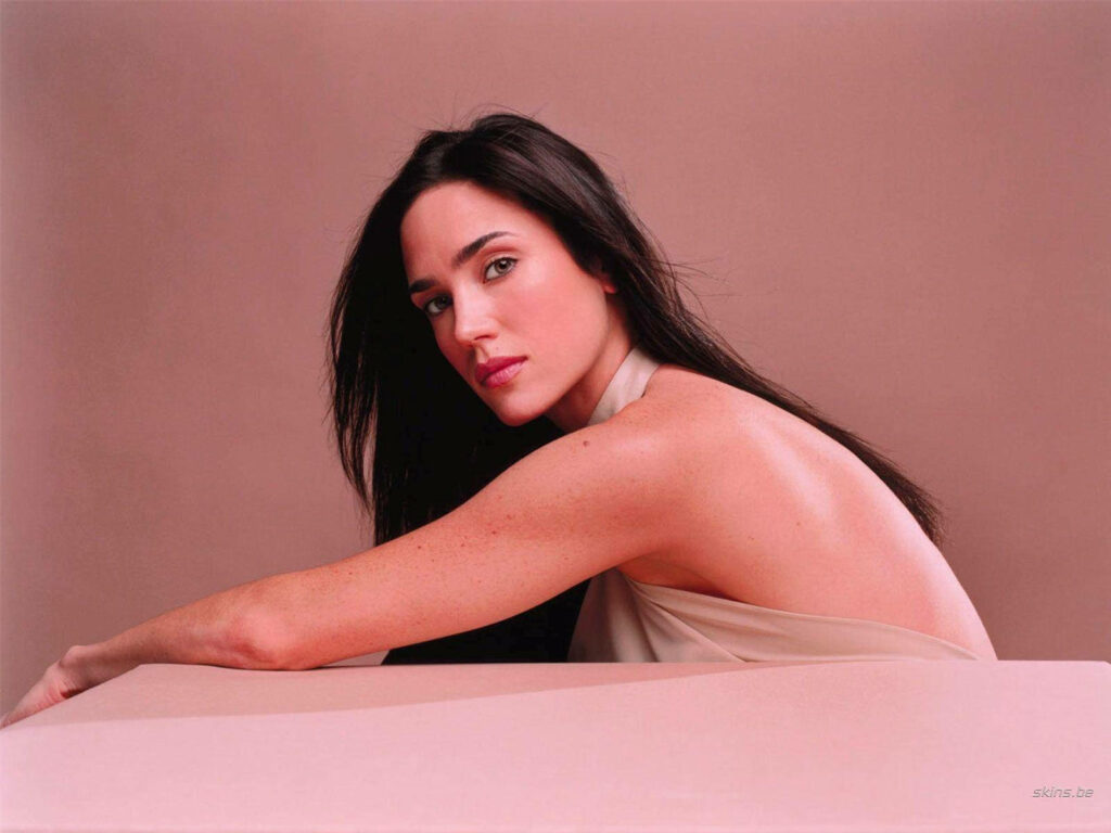 Jennifer Connelly elegant backless dress soft neutral background sophisticated wallpaper