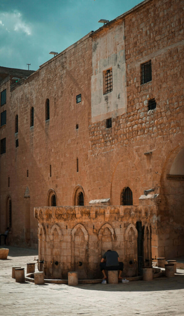 Jerusalem ancient stone arches and weathered walls illuminated by natural light wallpaper background