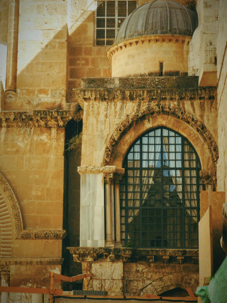 Jerusalem architecture wallpaper with ornate stone arches decorative columns and historic windows