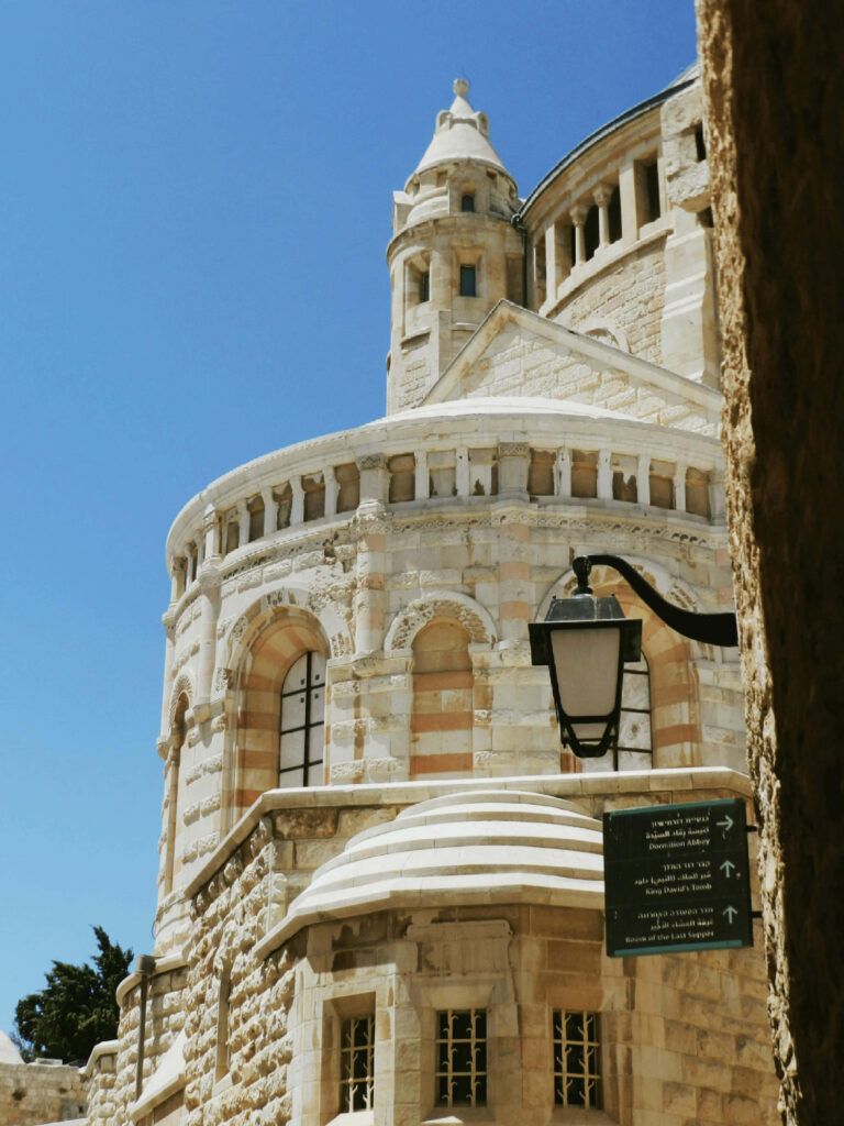 Jerusalem stone architecture with intricate ancient buildings under clear blue sky wallpaper