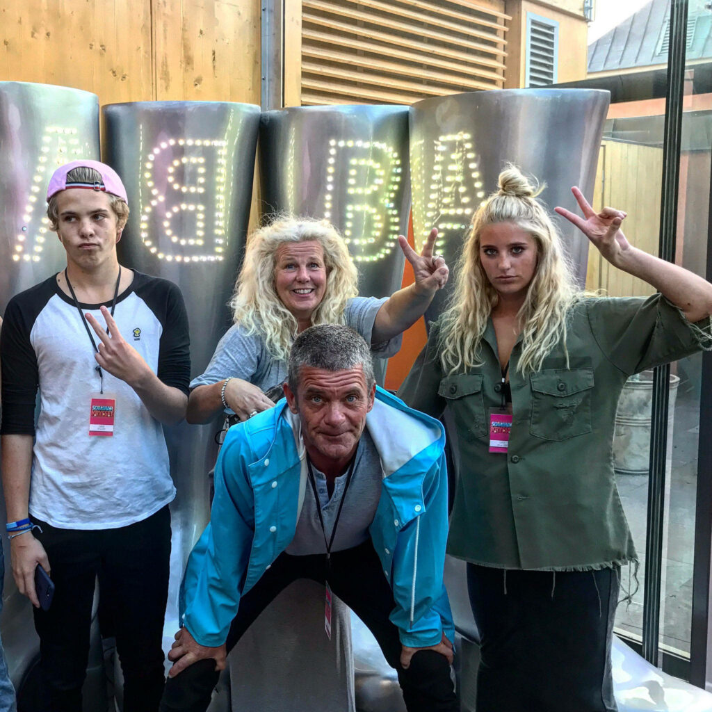 Jesper Parnevik family posing playfully with illuminated ABBA letters at music event wallpaper background