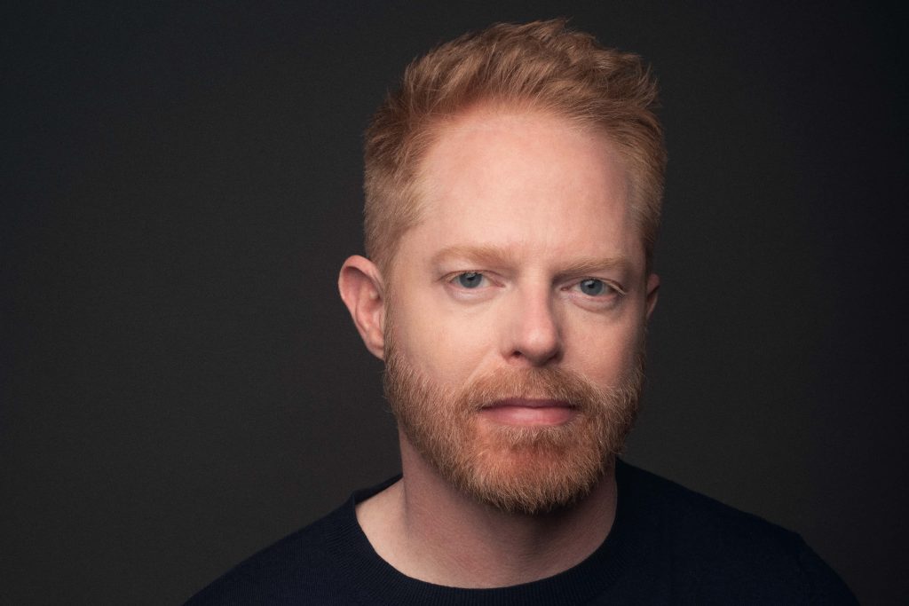 Jesse Tyler Ferguson portrait wallpaper with red hair beard dark background minimalist design