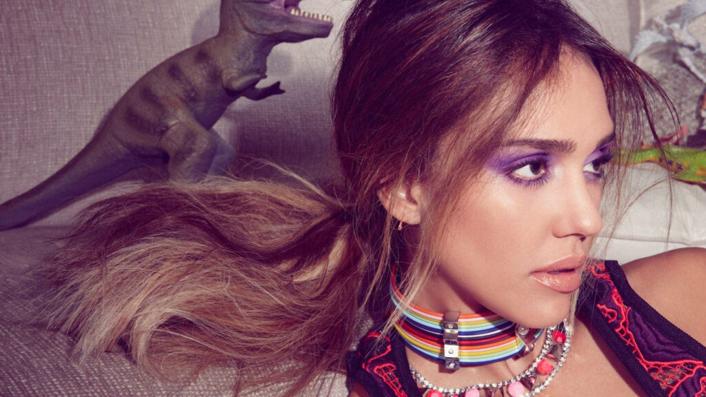 Jessica Alba with bold purple eye makeup vibrant accessories playful dinosaur InStyle wallpaper