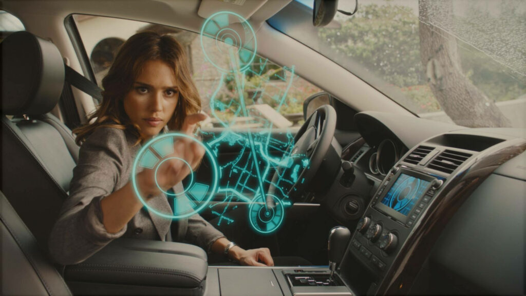 Jessica Alba in Spy Kids futuristic car using hightech touchscreen controls wallpaper background