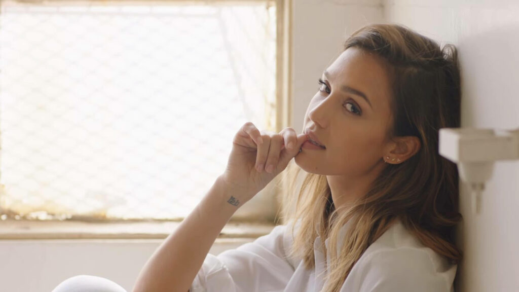 Jessica Alba in soft daylight gazing thoughtfully by a window intimate scene from The Eye Wallpaper