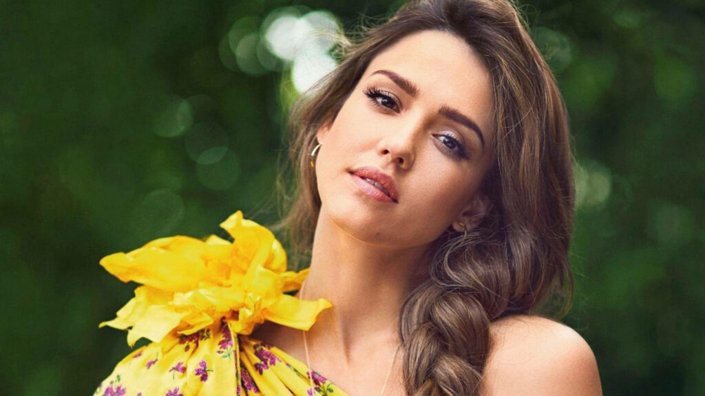 Jessica Alba in vibrant yellow floral dress against lush green background InStyle Magazine 2018 Wallpaper